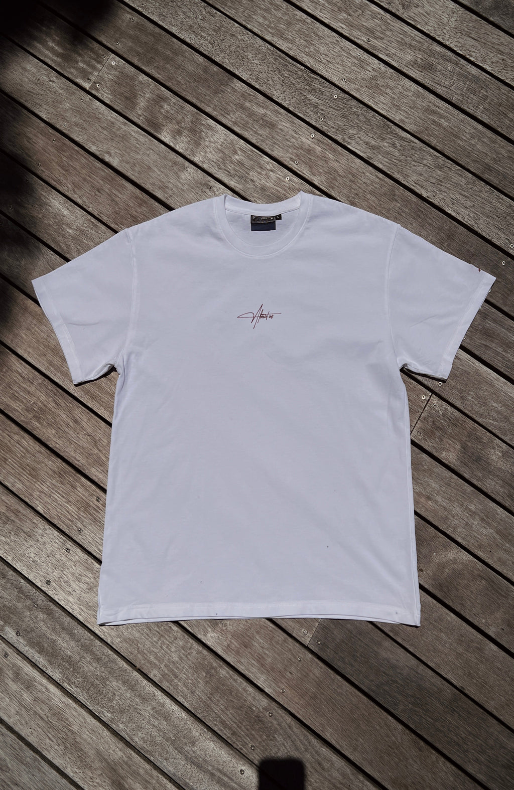 About Us Essential Training T-Shirt — lifestyle shot, worn during training