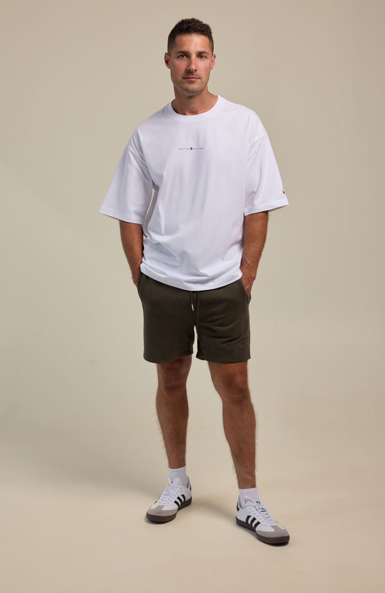 About Us Oversized Logo T-Shirt — back view, boxed heavyweight cotton