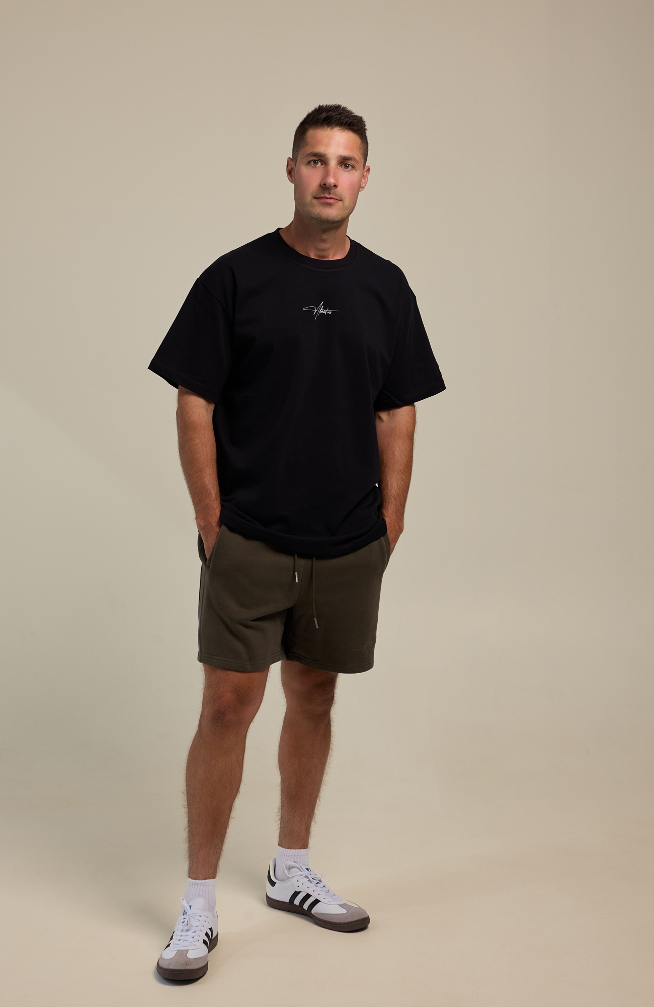 About Us - Signature Logo - Loose Fit T Shirt
