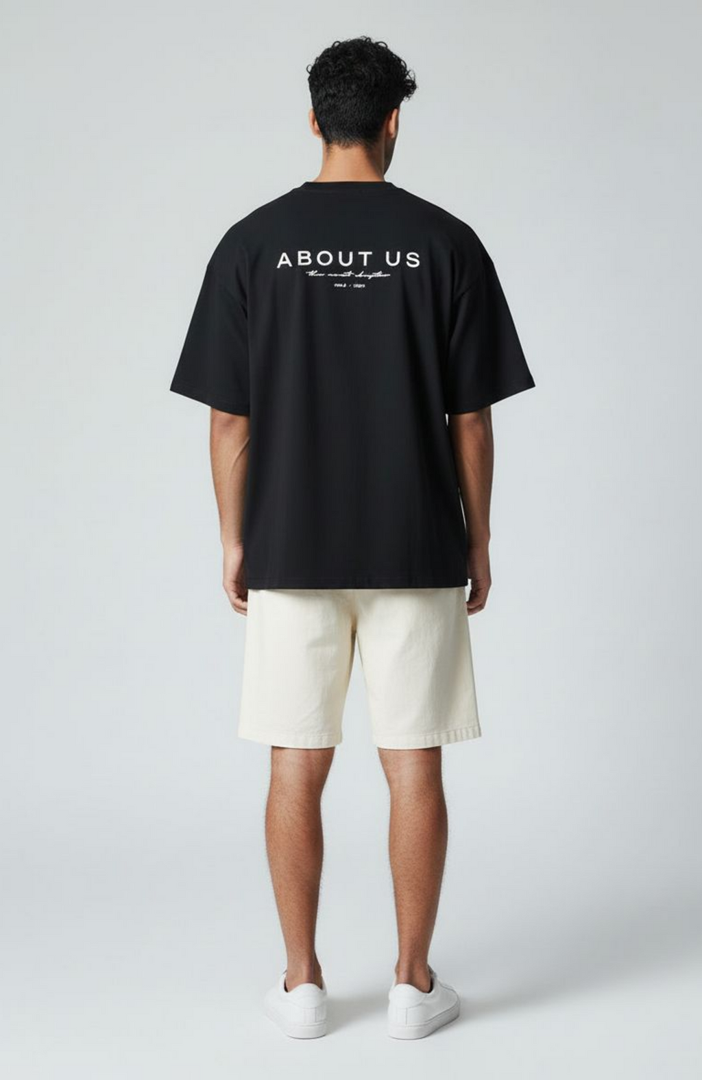About Us The Next Chapter Oversized T-Shirt — Black colourway, boxed fit