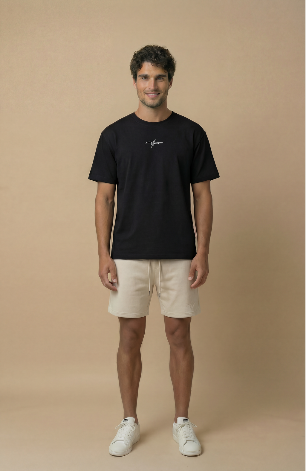 About Us Signature Logo Loose Fit T-Shirt — back view, premium soft cotton drape