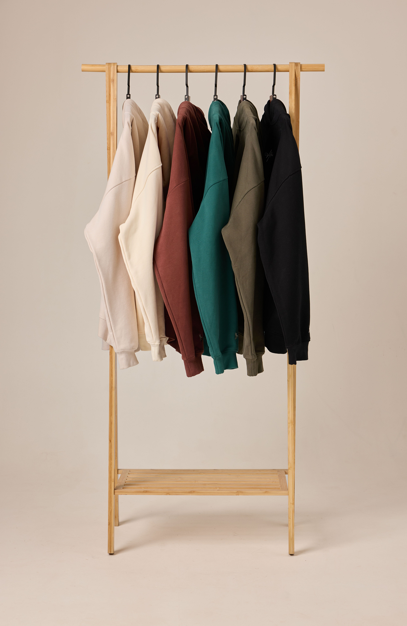 About Us Native Hoodie range — all colourways hanging