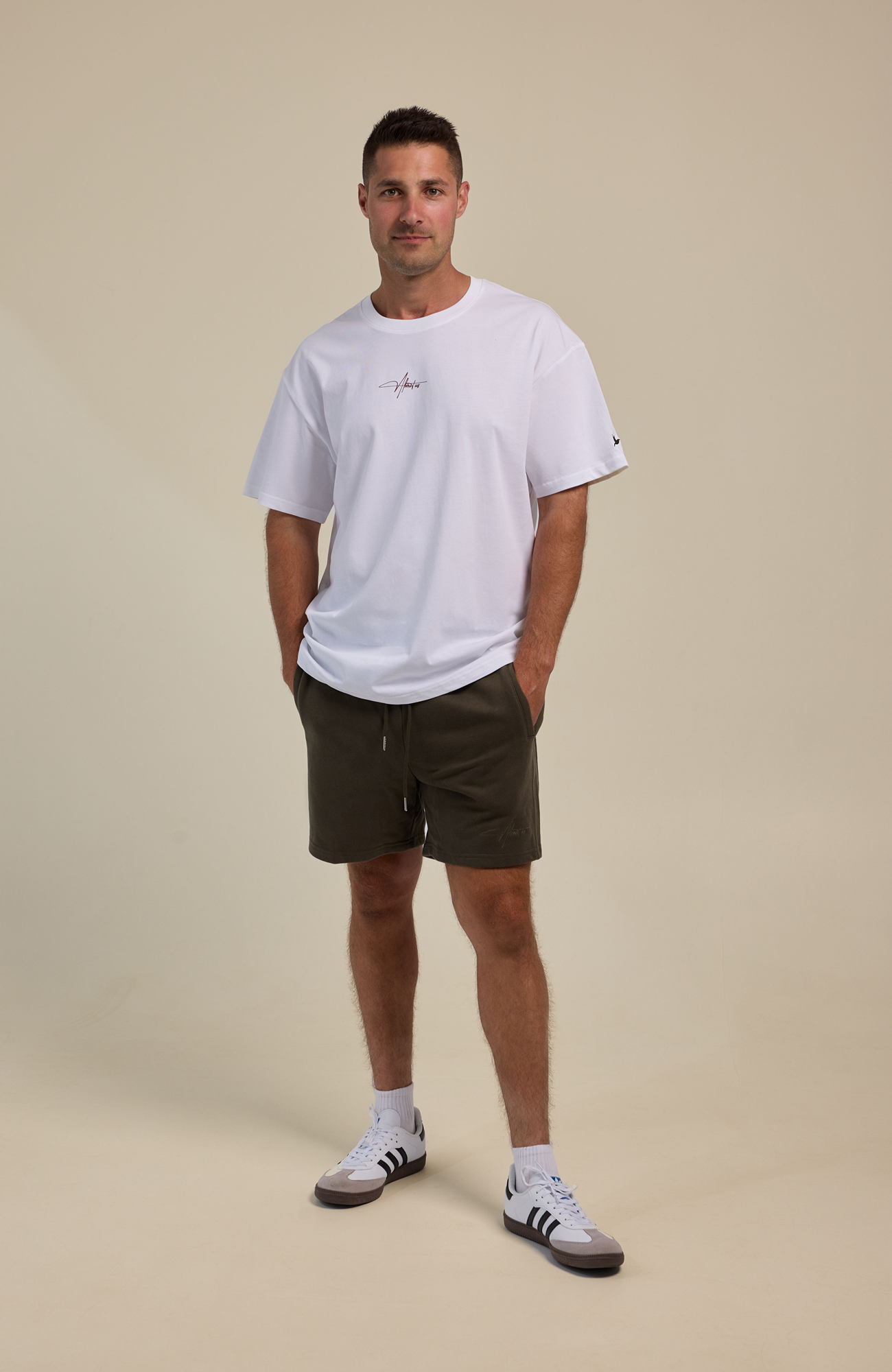 About Us Essential Training T-Shirt — back view, soft drape 100% cotton