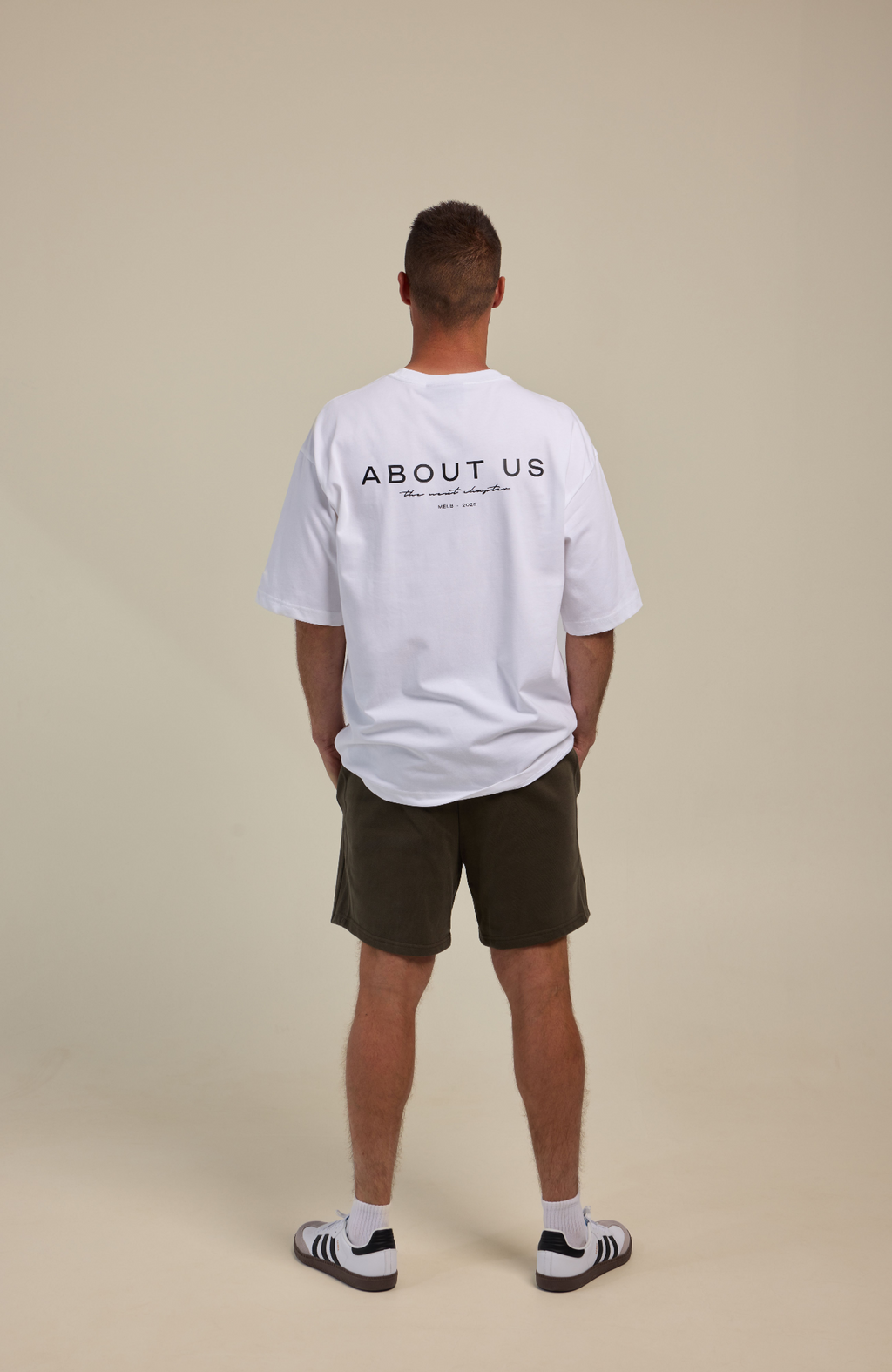 About Us The Next Chapter Oversized T-Shirt — White colourway, full length