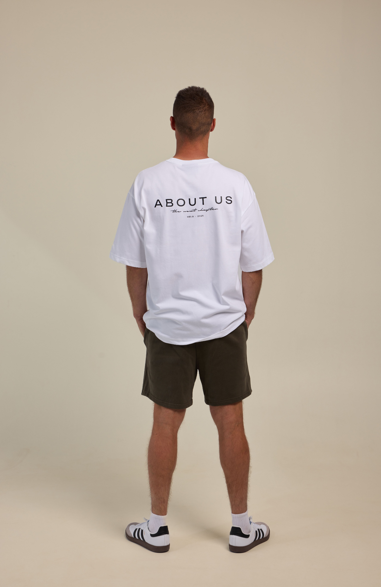 About Us The Next Chapter Oversized T-Shirt — White colourway, full length