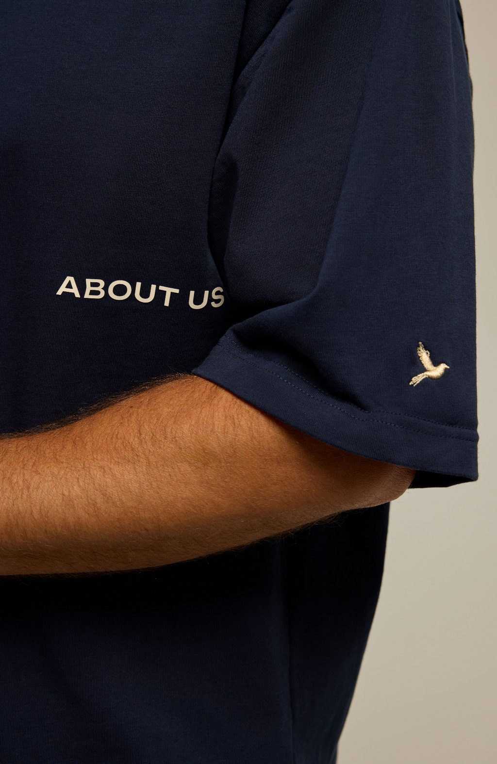 About Us The Next Chapter Oversized T-Shirt — chest graphic detail