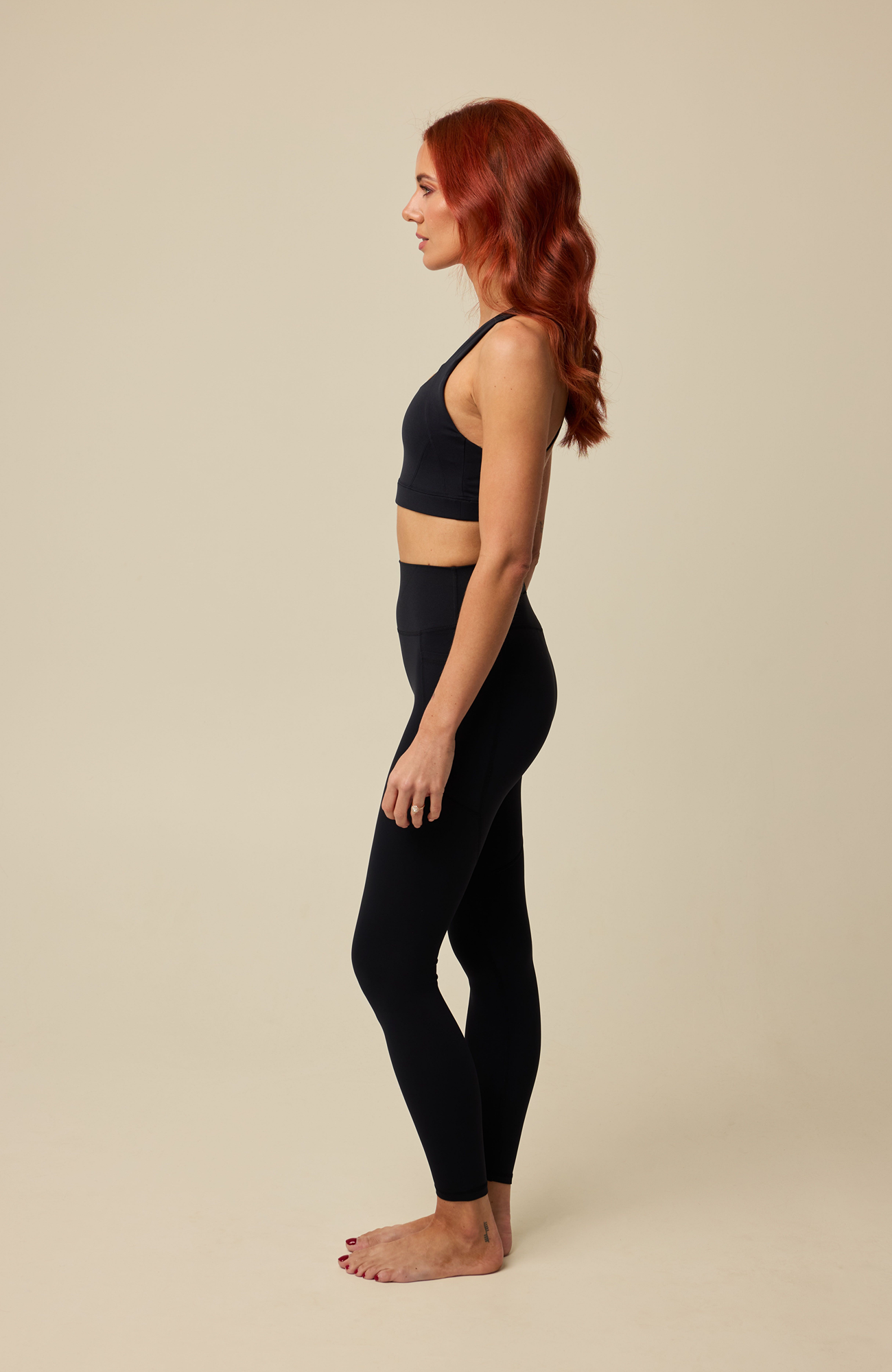 About Us Aura black sports leggings, side view