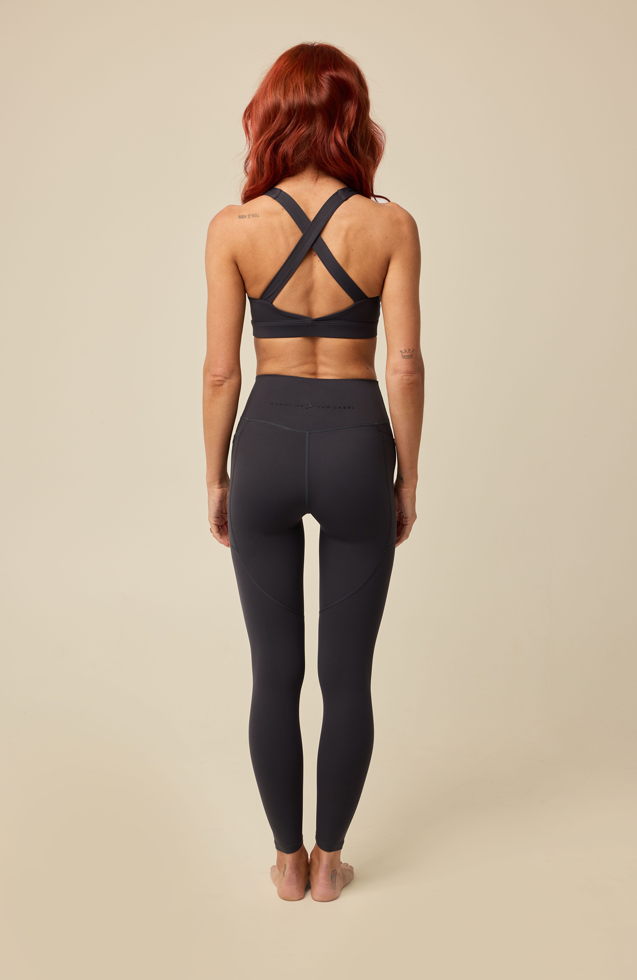 About Us Aura navy sports leggings, back view