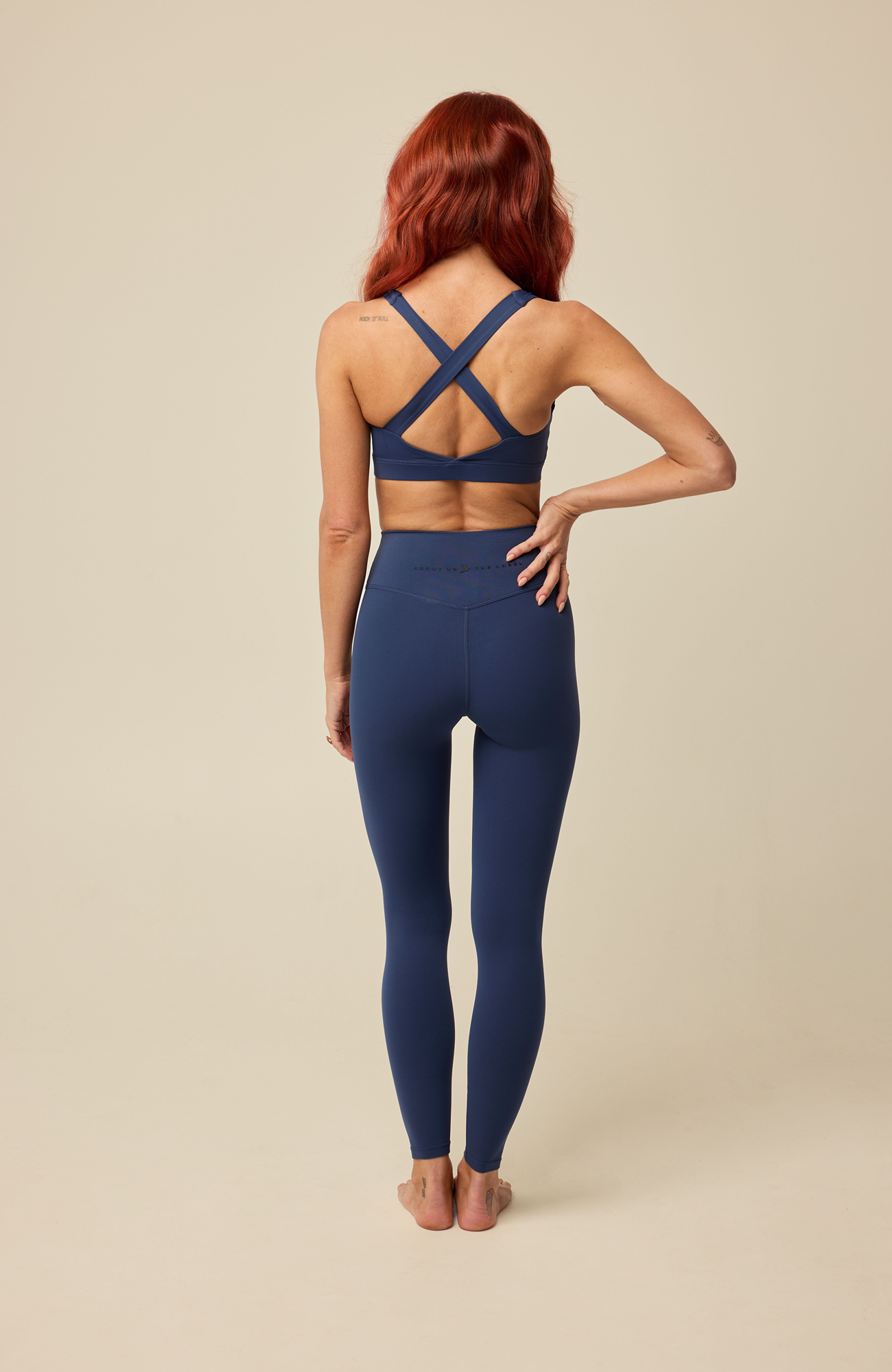 About Us Aura navy sports leggings, back view
