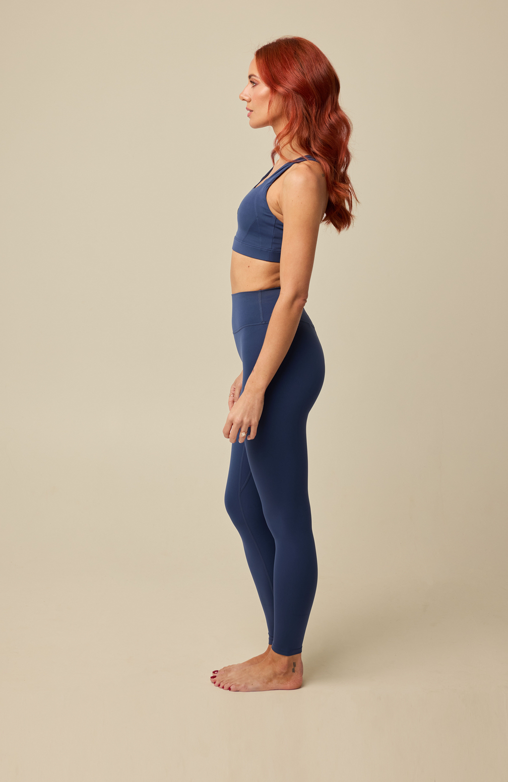 About Us Aura navy sports leggings, side view