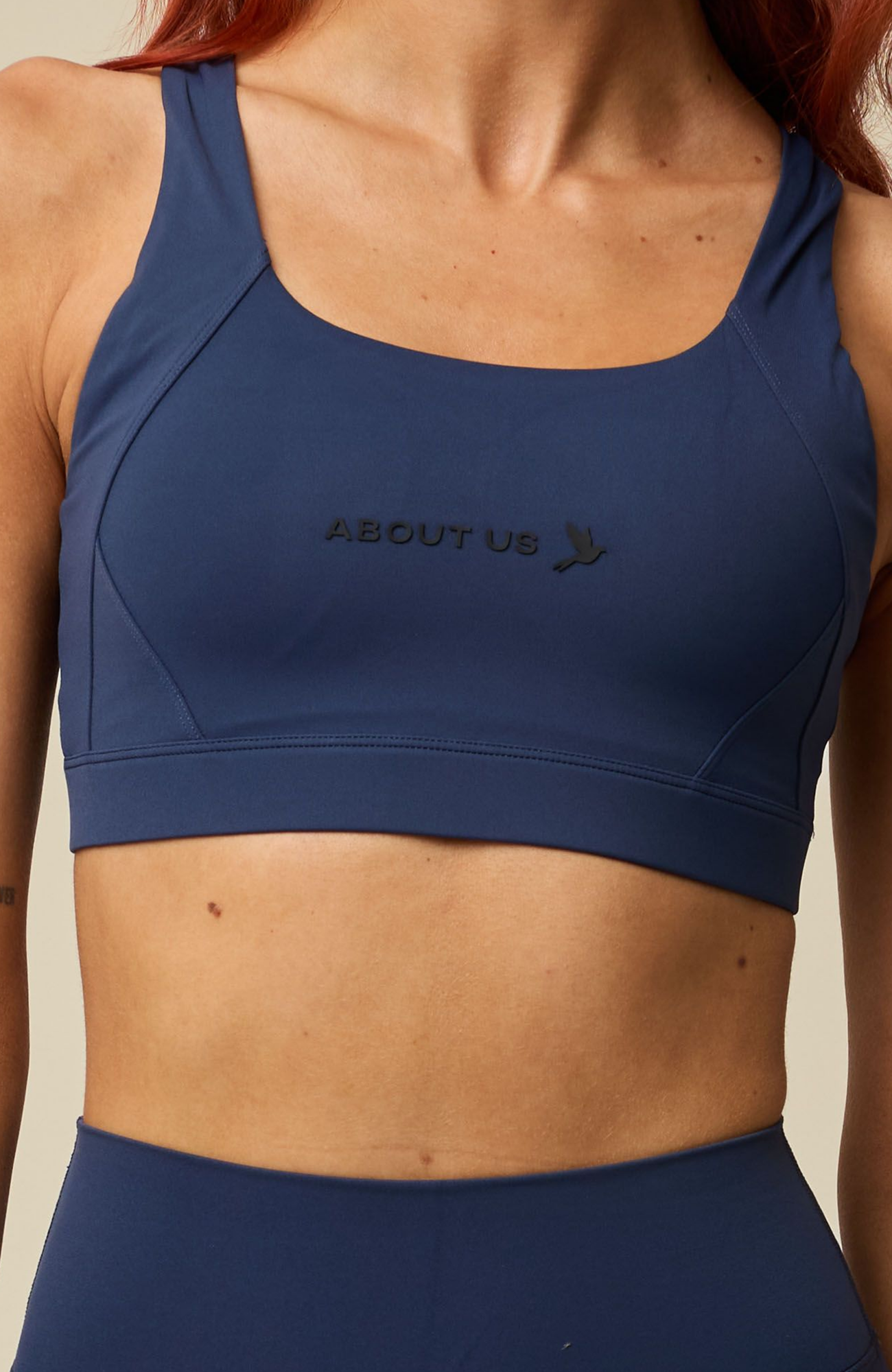 About Us Aura navy sports bra, front detail