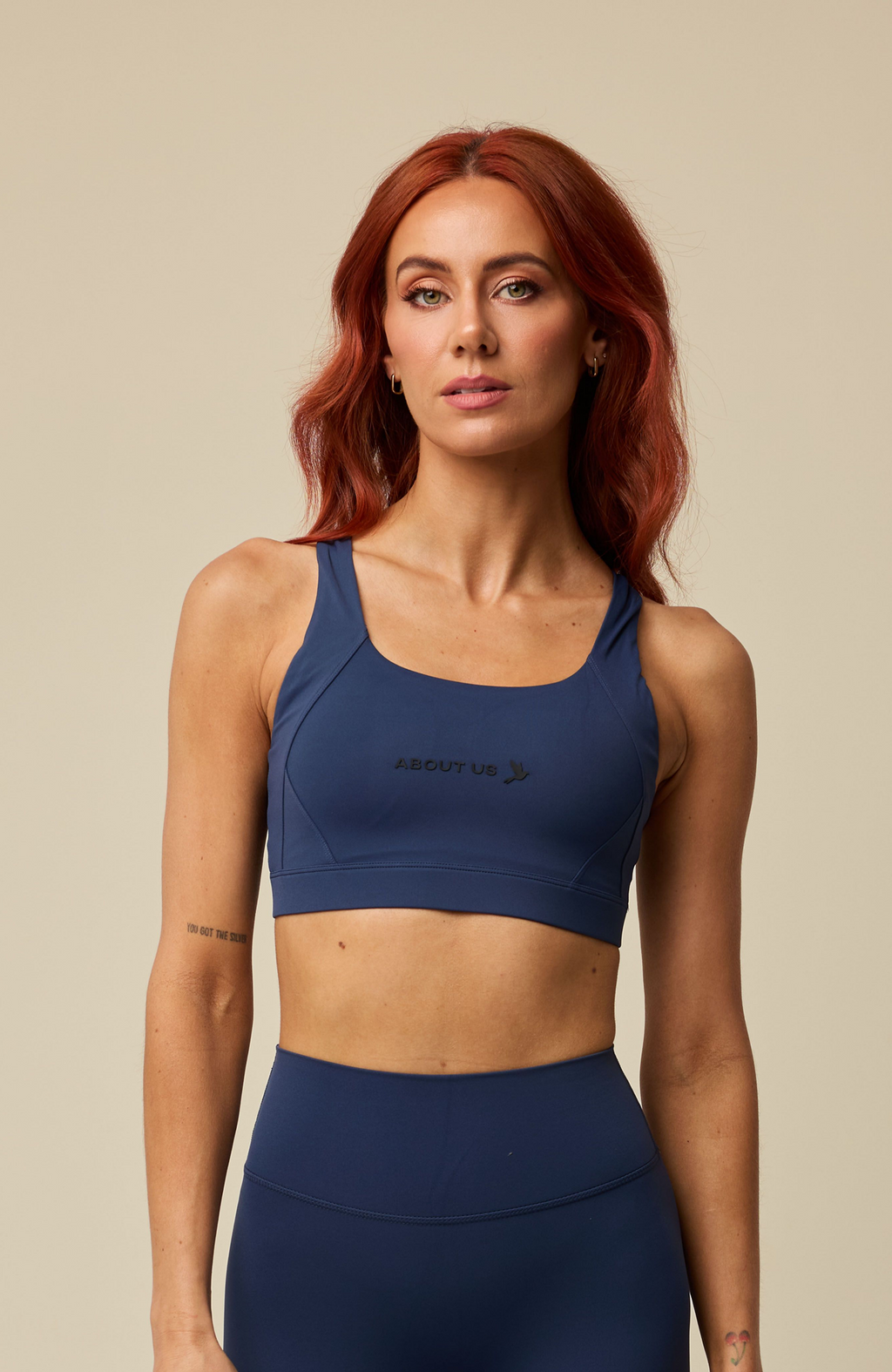 About Us Aura navy sports bra, front