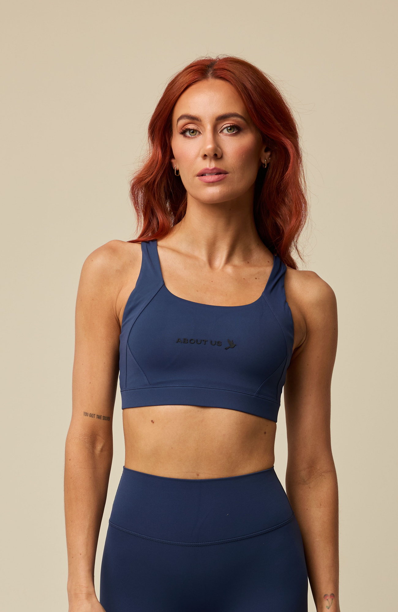About Us Aura navy sports bra, front